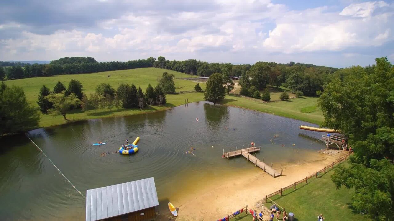folks playing in camp horizon's lake