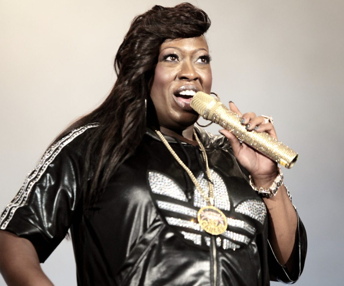 Rapper Missy Elliot with a gold microphone 