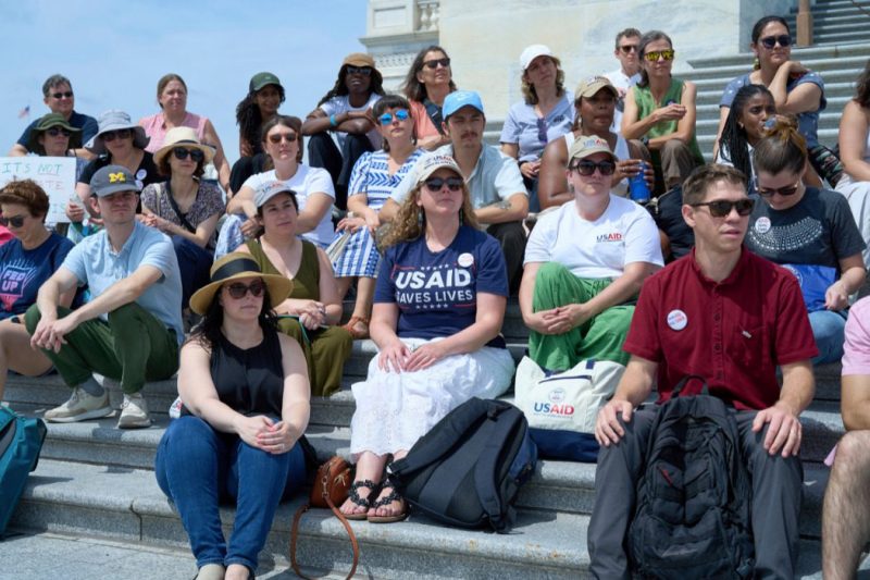 Former federal workers who lost their jobs in President Donald Trump's DOGE layoffs, gather on the steps of the Capitol in Washington, Tuesday, June 10, 2025.